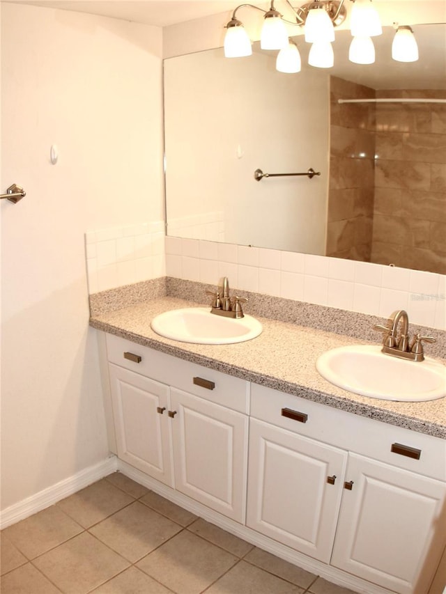 bathroom featuring vanity, backsplash, and tile patterned flooring