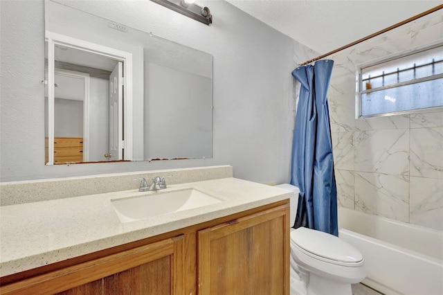 full bathroom with shower / tub combo with curtain, vanity, and toilet