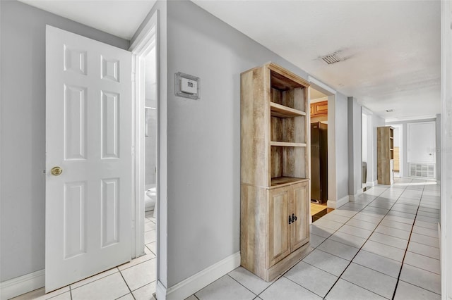 hallway with light tile patterned flooring