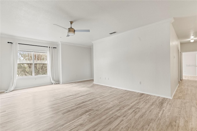 empty room with crown molding, ceiling fan, a textured ceiling, and light wood-type flooring