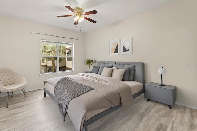 bedroom featuring ceiling fan and light wood-type flooring