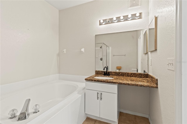 bathroom with vanity, independent shower and bath, and tile patterned flooring