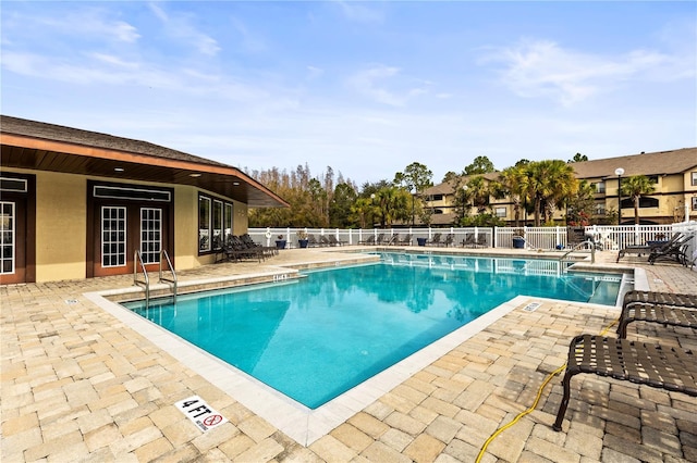 view of swimming pool with a patio area