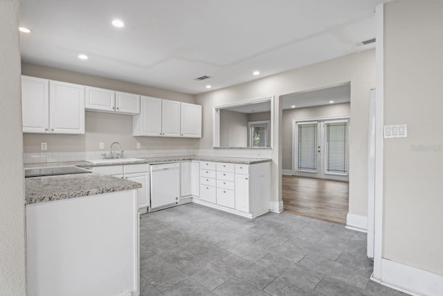 kitchen featuring white cabinets, sink, and dishwasher