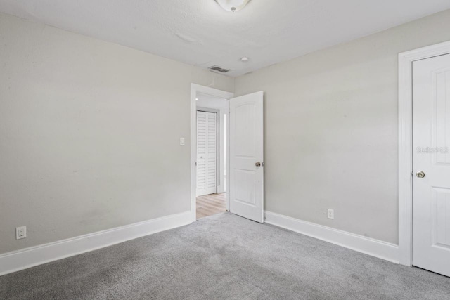 spare room with carpet floors