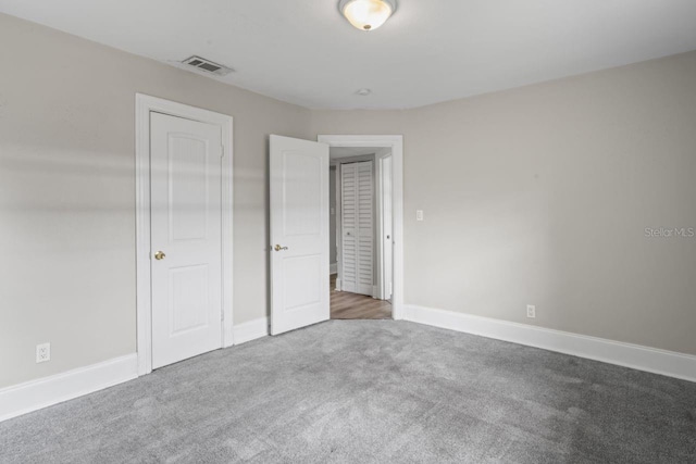 unfurnished bedroom featuring carpet flooring