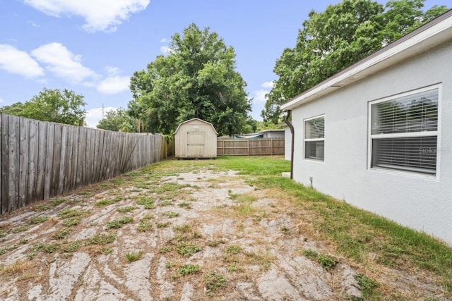 view of yard with a storage shed