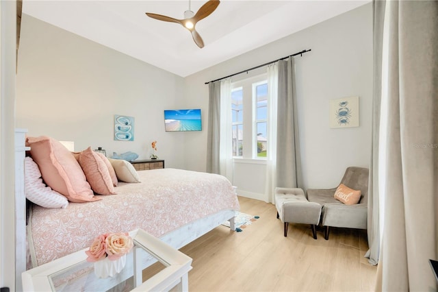 bedroom featuring ceiling fan and light hardwood / wood-style flooring