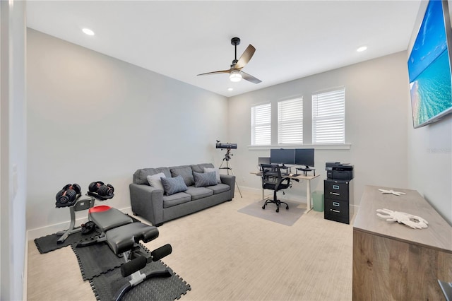 office space with ceiling fan and carpet