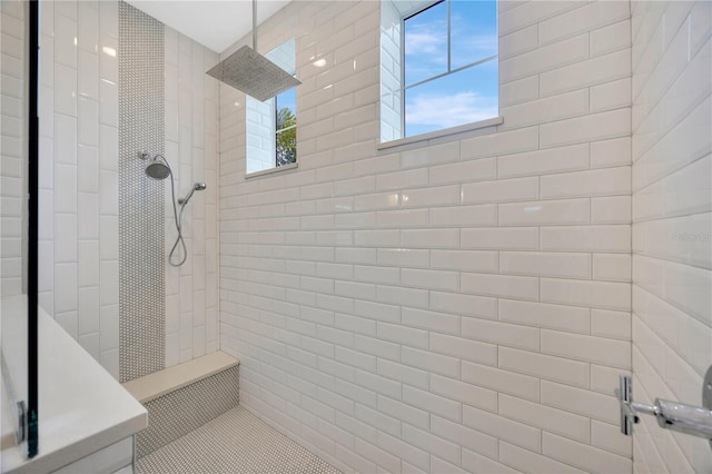 bathroom with a tile shower