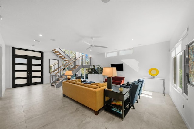 living room featuring plenty of natural light and french doors