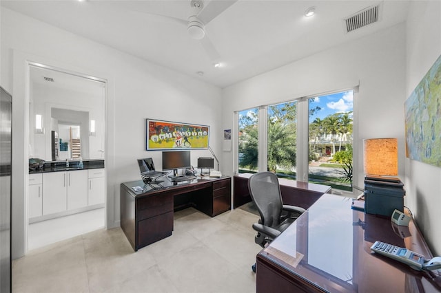 office space featuring a ceiling fan, recessed lighting, and visible vents