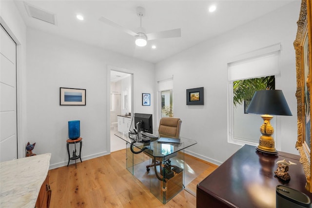 office space with baseboards, ceiling fan, recessed lighting, and light wood-style floors