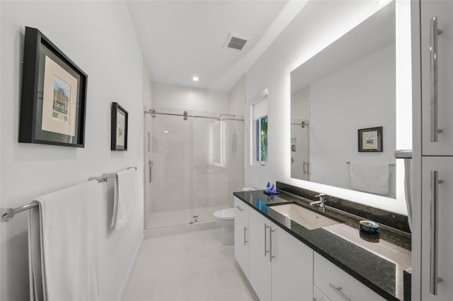 full bathroom featuring visible vents, toilet, a stall shower, vanity, and tile patterned flooring