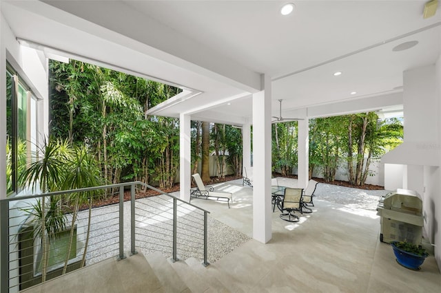 view of patio with a fenced backyard and a grill