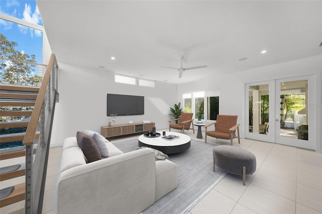 living room with french doors, light tile patterned floors, recessed lighting, a ceiling fan, and stairs