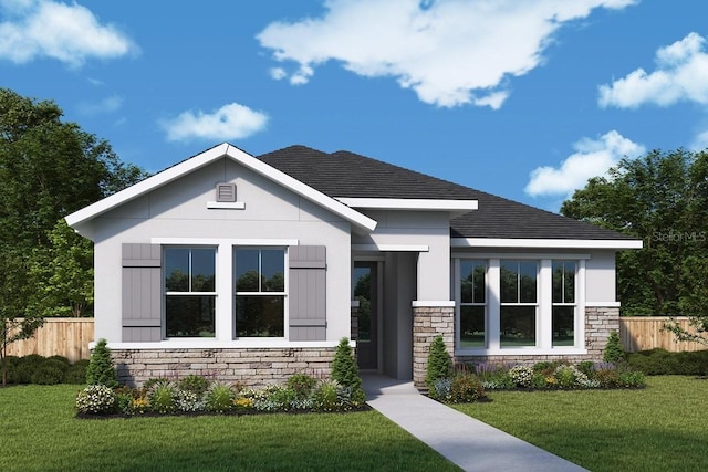 view of front of home featuring a front yard, fence, and stone siding