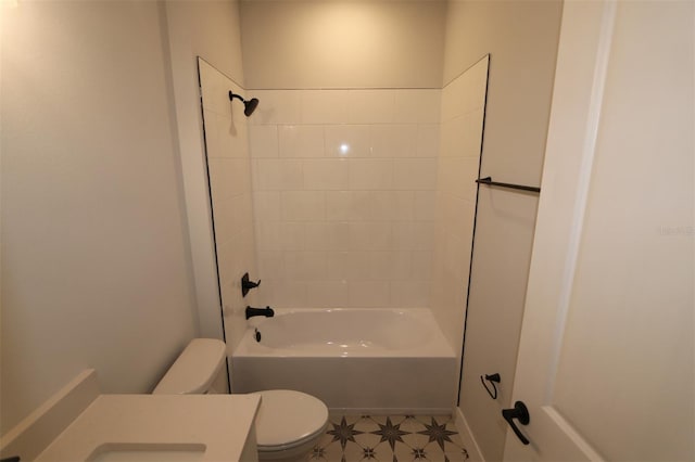 bathroom featuring vanity, toilet, and washtub / shower combination