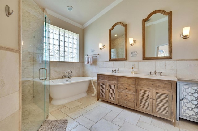 bathroom with ornamental molding, tile walls, plus walk in shower, and vanity