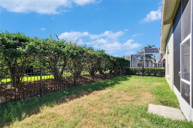 view of yard with a lanai