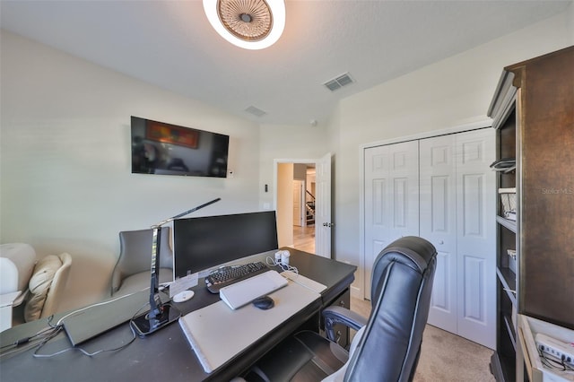 office space featuring visible vents and light colored carpet