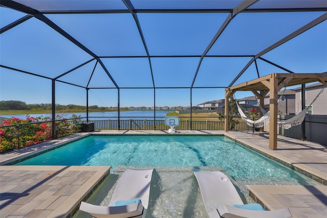 view of pool featuring a pool with connected hot tub, glass enclosure, a patio area, and a water view