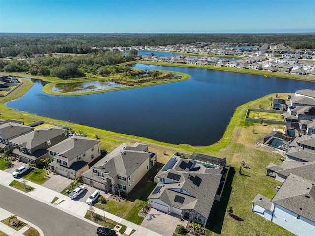 birds eye view of property featuring a water view and a residential view