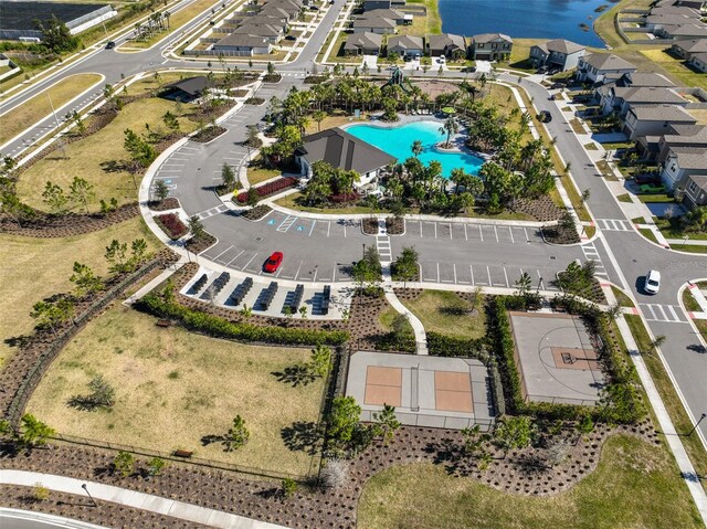 bird's eye view with a water view and a residential view