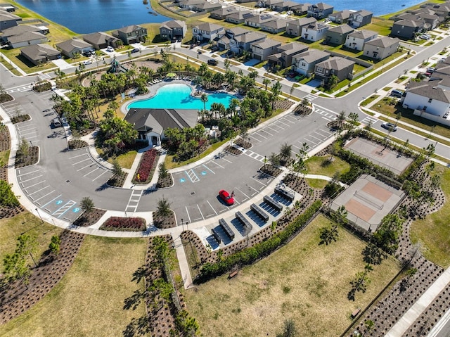 bird's eye view featuring a residential view and a water view