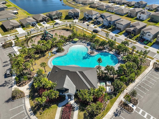 bird's eye view with a residential view and a water view