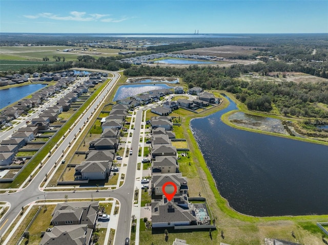 bird's eye view with a water view and a residential view