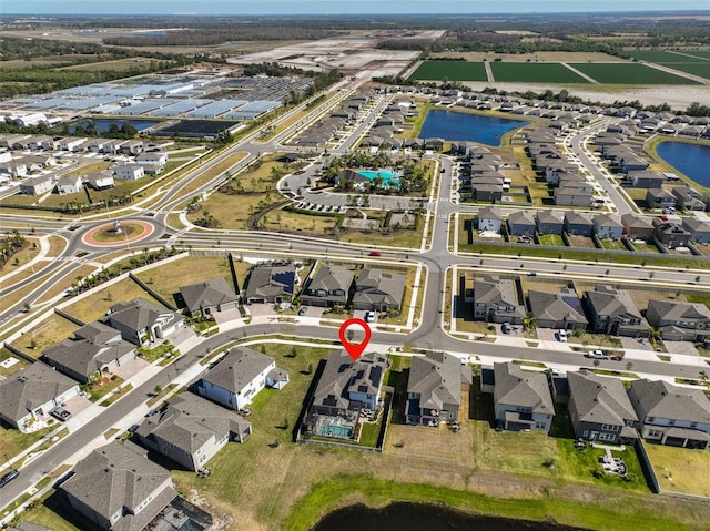 aerial view with a water view and a residential view