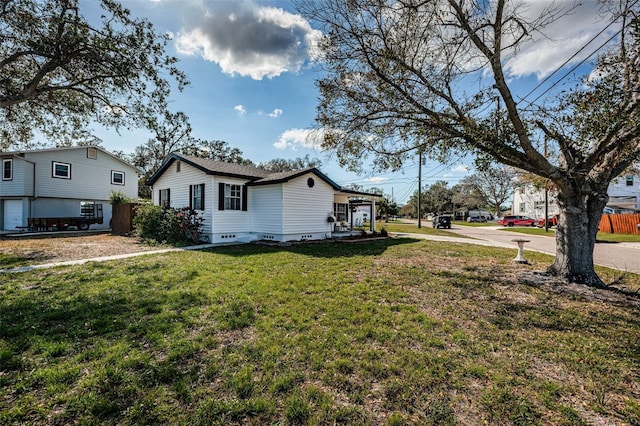 view of property exterior featuring a lawn