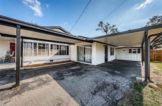 exterior space featuring a carport