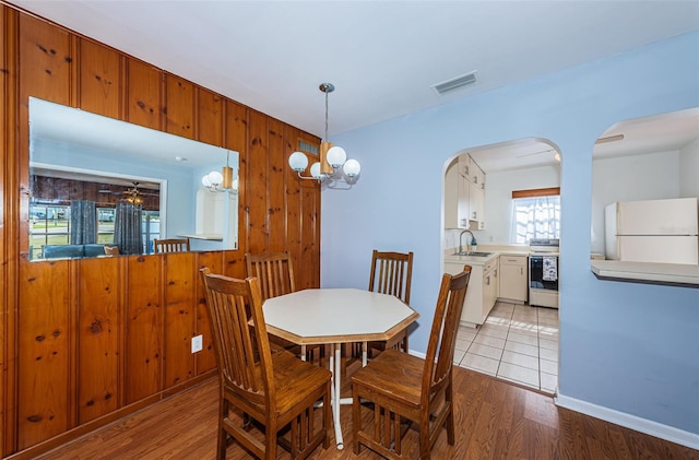 dining room featuring sink and light wood-type flooring