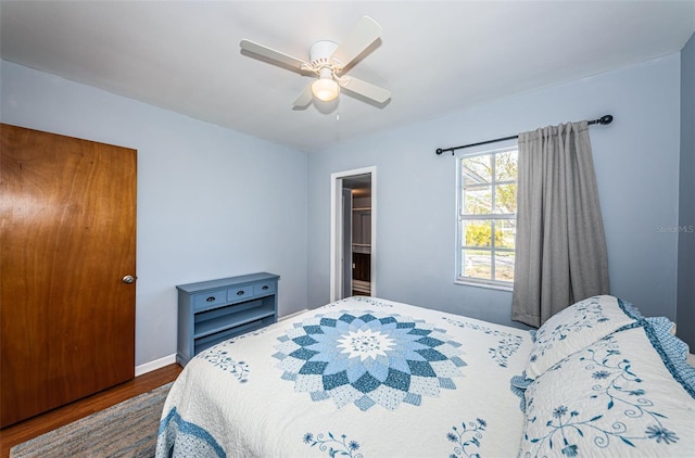 bedroom featuring dark wood-type flooring and ceiling fan