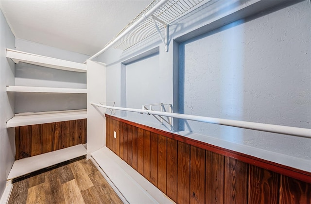 spacious closet featuring hardwood / wood-style floors