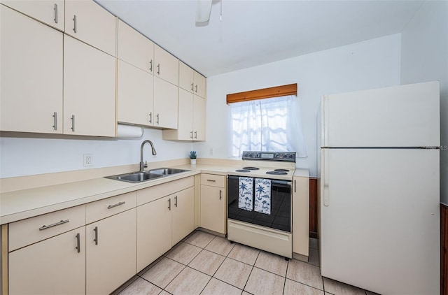 kitchen with sink, light tile patterned floors, and white appliances