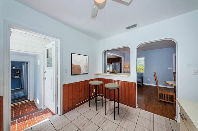 kitchen with ceiling fan and light tile patterned floors