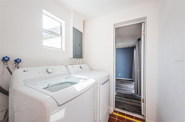 washroom with washer and clothes dryer and electric panel