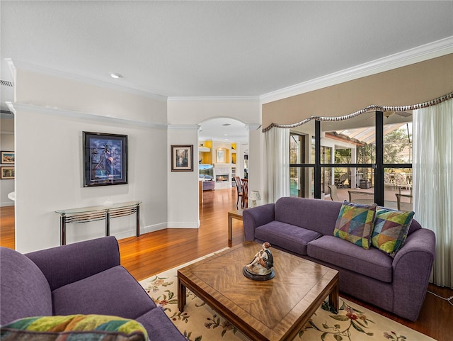 living room with hardwood / wood-style floors and ornamental molding