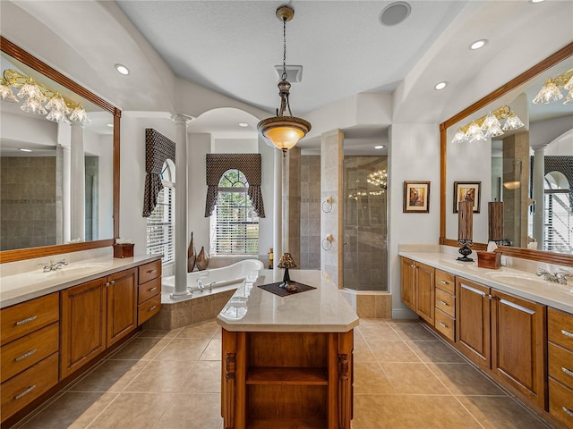 bathroom featuring ornate columns, vanity, and tile patterned floors