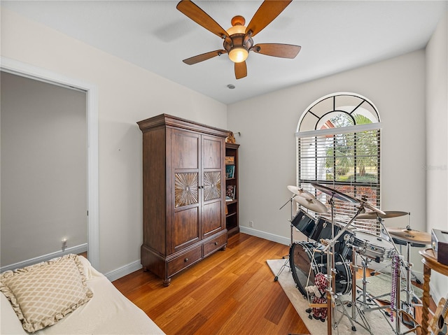 misc room featuring light hardwood / wood-style floors and ceiling fan