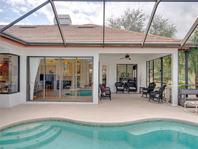 exterior space featuring ceiling fan, a lanai, and a patio area