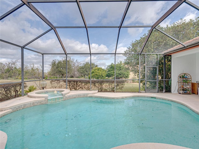 view of swimming pool featuring an in ground hot tub, a lanai, and a patio