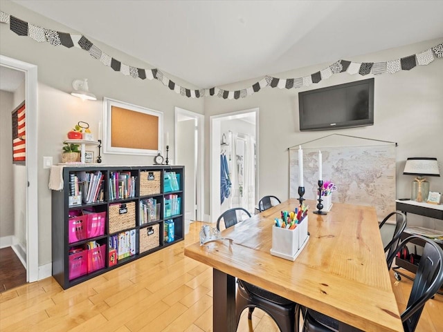 dining area with hardwood / wood-style floors