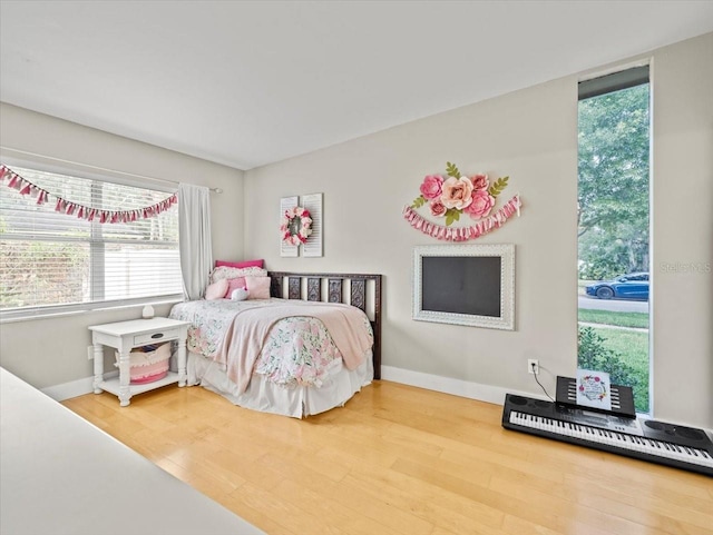 bedroom with hardwood / wood-style floors