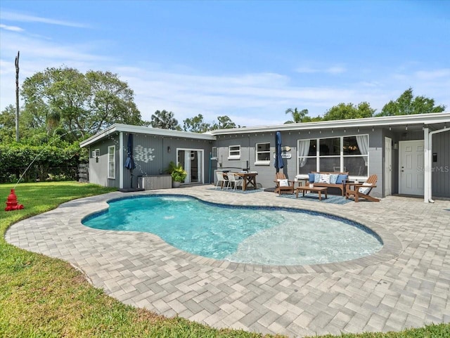 view of pool featuring a patio and an outdoor hangout area