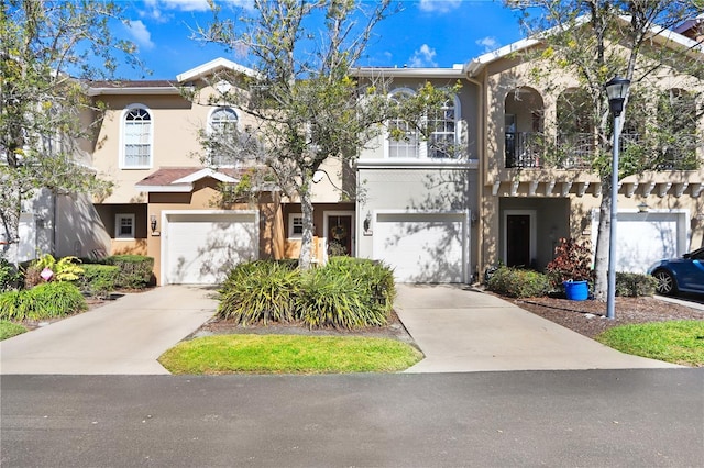 townhome / multi-family property featuring a garage