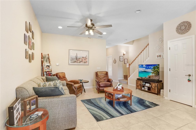 living room with ceiling fan and light tile patterned floors